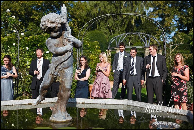 Birtsmorton Court wedding photography of guests in the white garden