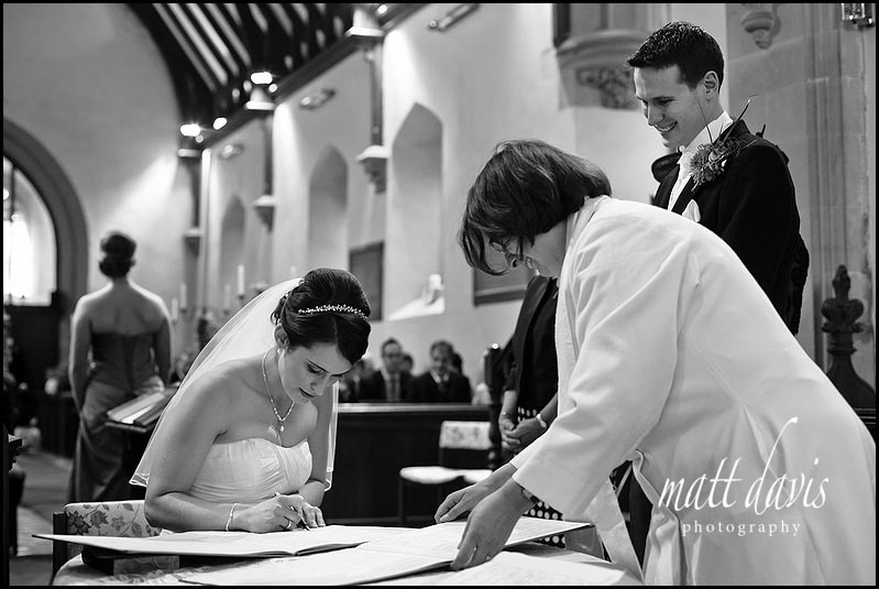 signing the wedding register in Birtsmorton Church