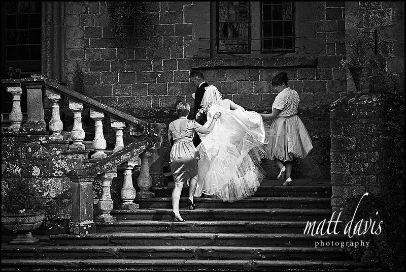 Clearwell Castle steps with bride and dress
