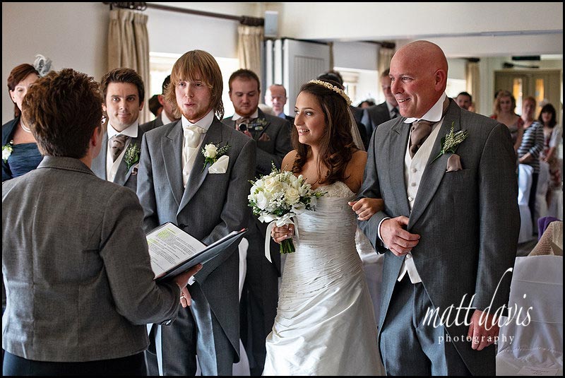 brides walking down the aisle at Manor House Hotel