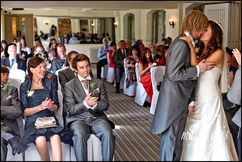 first kiss during wedding ceremony at Manor House Hotel