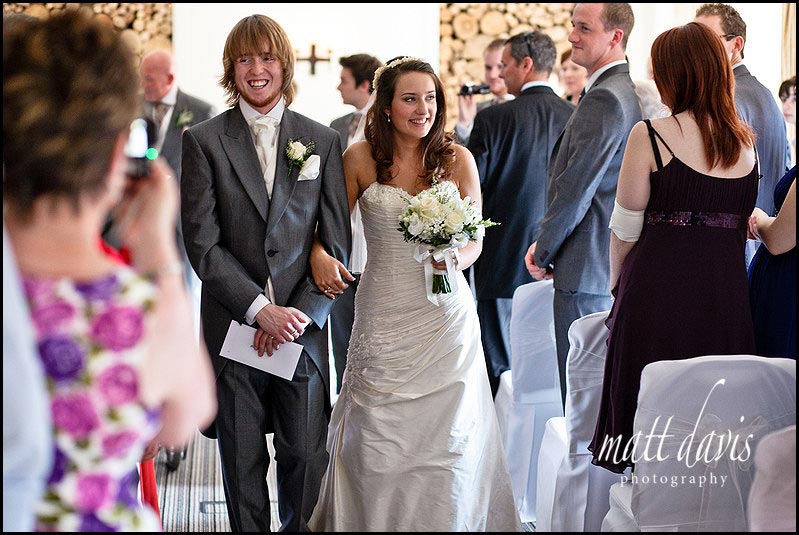 Manor House Hotel wedding photography of couple leaving ceremony