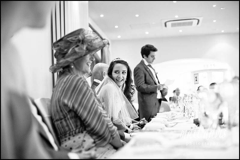 bride laughing during speeches at Manor House Hotel