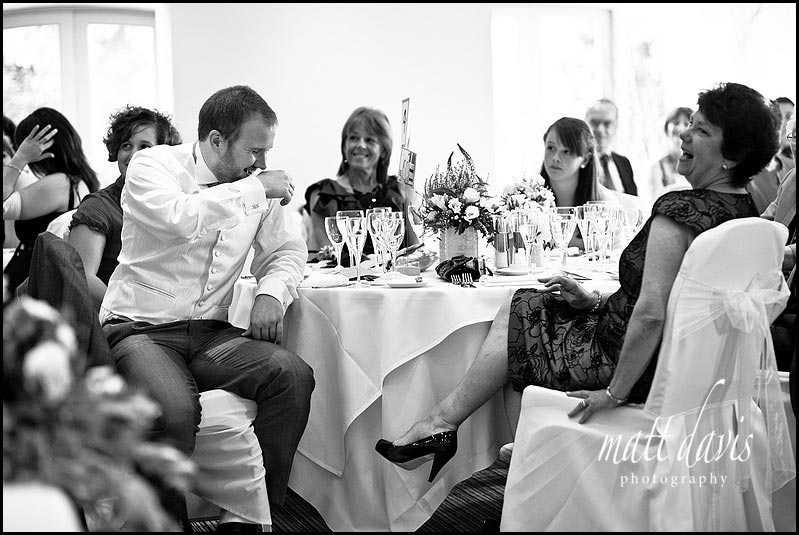 guests laugh during speeches at Manor House Hotel