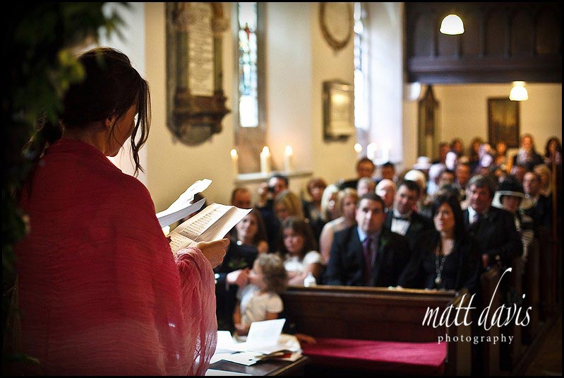 Wedding reading inside Kingscote Church 