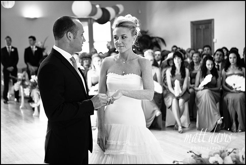 Ring exchange during indoor wedding ceremony at Matara