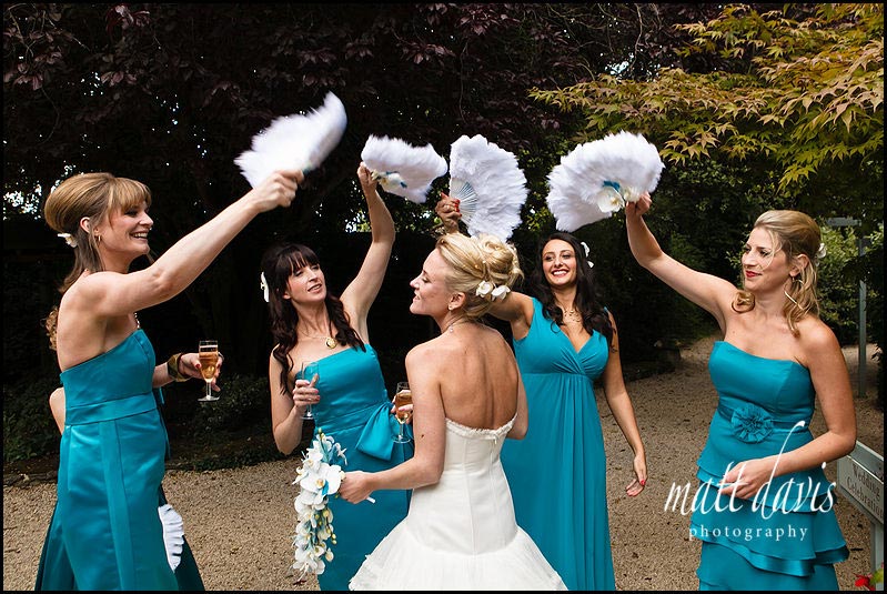 feather fans for bridesmaids at wedding