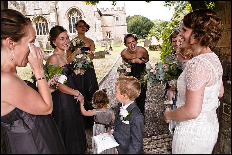 Bridesmaids and bride arriving at Crudwell church, Wiltshire