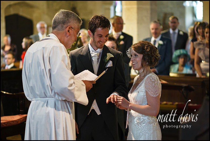 Wedding ring exchange photo in Crudwell church