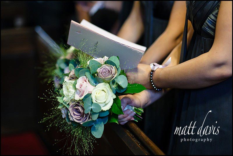 Wedding flowers held by bridesmaid