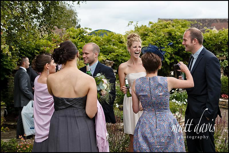 Wedding guests in Winkworth Farm garden