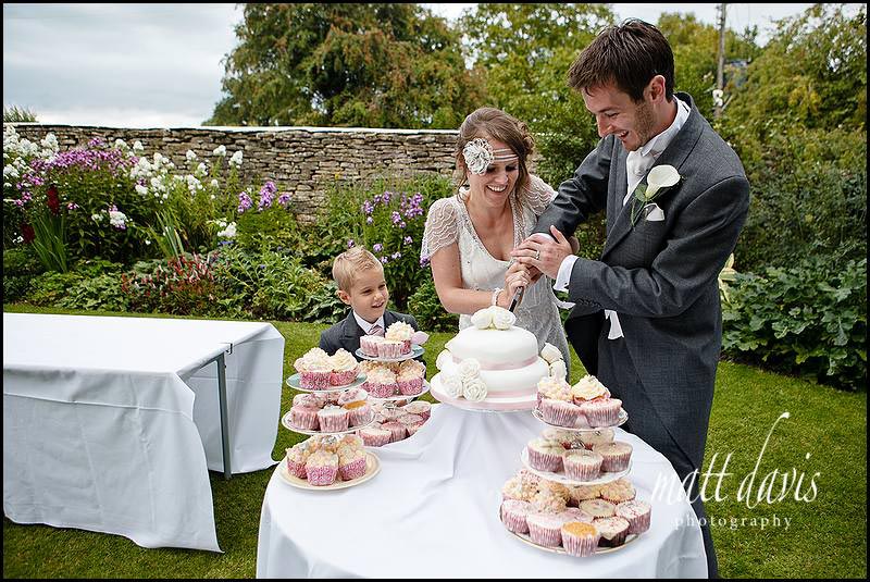 Winkworth Farm wedding photos of cake cutting
