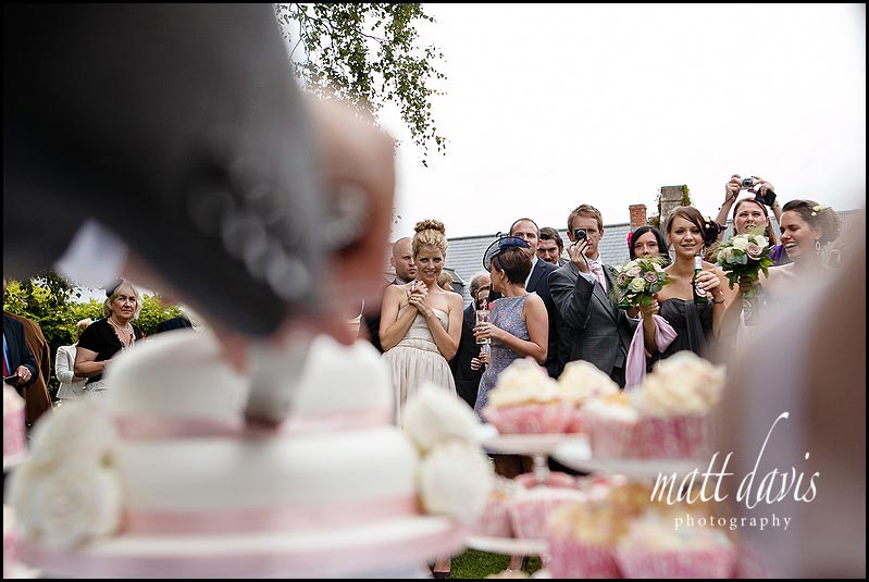 Wedding guest photo during cake cutting