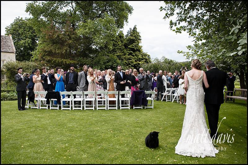 Arrival of the bride at an outdoor wedding ceremony at Friars Court
