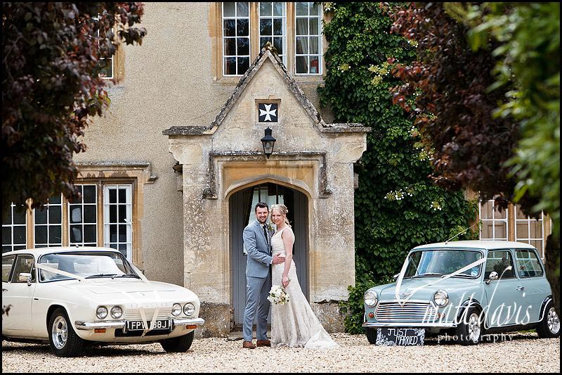 vintage wedding cars and couple outside Friars Court