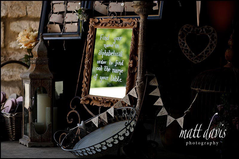 Vintage mirror table plan idea at wedding