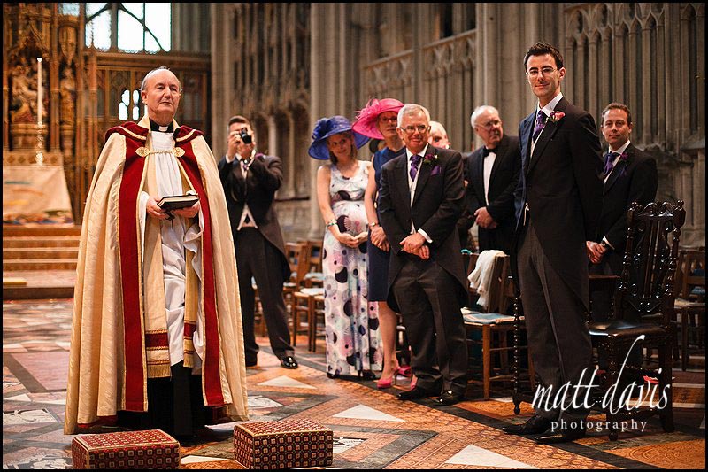 groom waits for brides arrival at Gloucester Cathedral