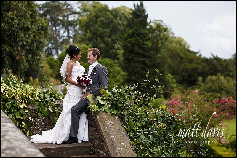 bride and groom pose for Berkeley Castle wedding photos