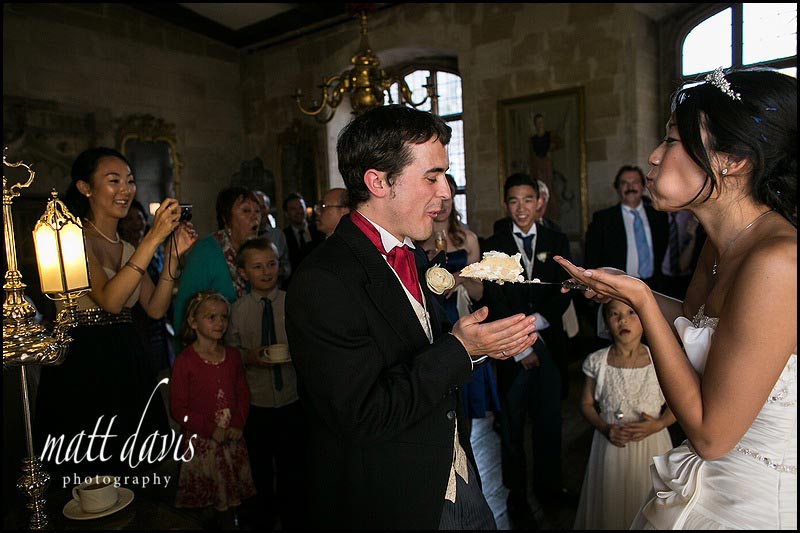 cake cutting at Berkeley Castle by the bride and groom