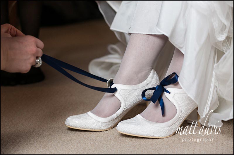 Wedding-at-Berkeley-Castle-009 white wedding shoes with blue ribbon laces
