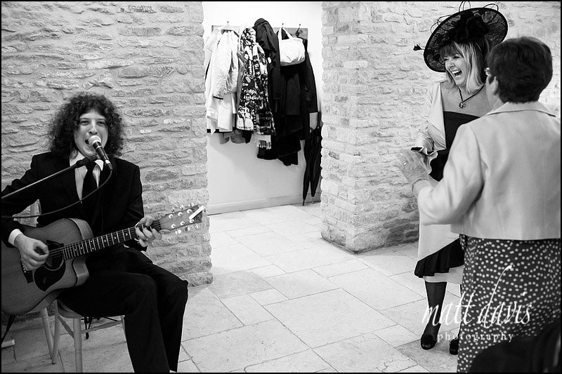 Musician playing at Kingscote Barn for a winter wedding