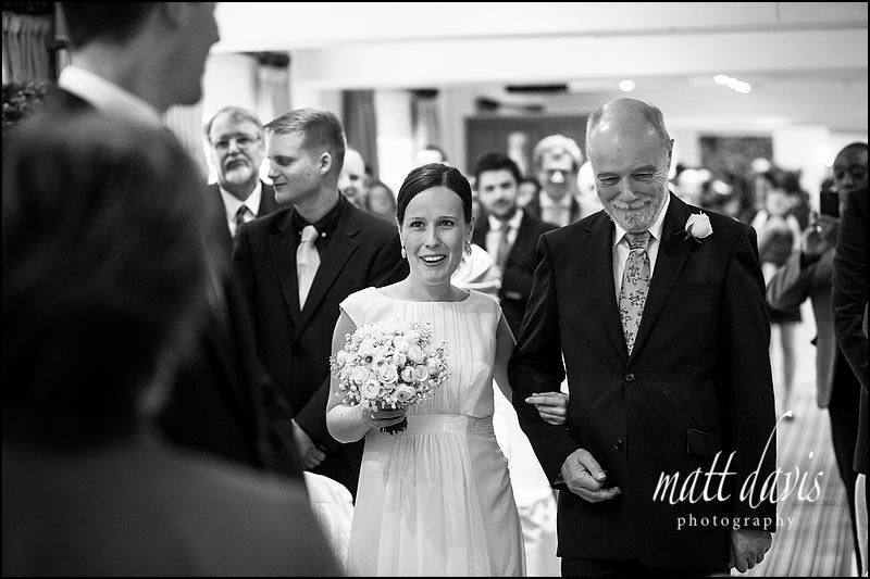 Bride walking down the aisle for wedding at Manor House Hotel