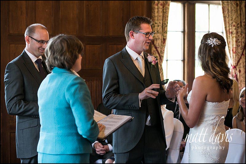 Groom with hot hands unable to put ring on brides finger