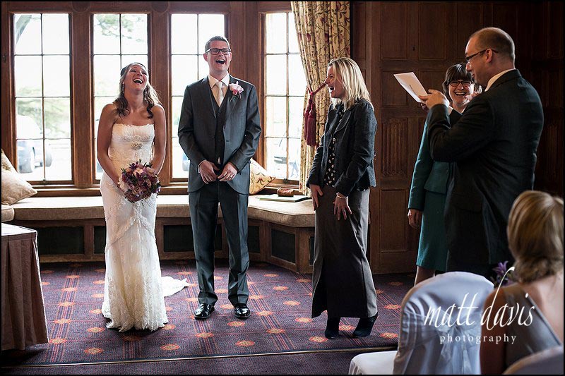 Dumbleton Hall wedding photos taken during the receiving of the marriage certificate