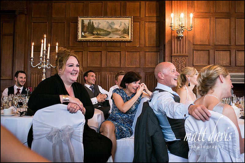 Dumbleton Hall wedding photos of guests laughing during speeches