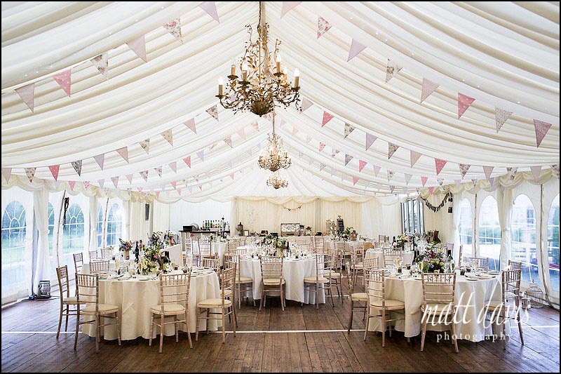 Wedding marquee at Friars Court decorated with pink bunting and vintage details