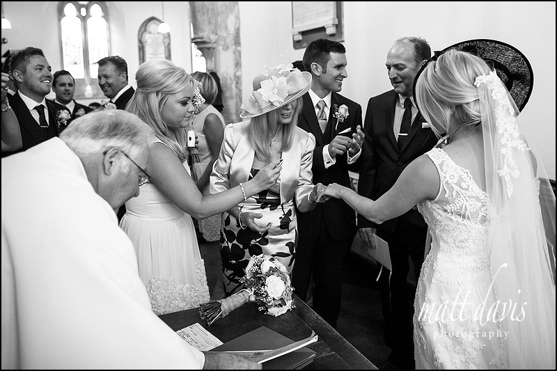 black and white documentary wedding photography at Kingscote Church, Gloucestershire