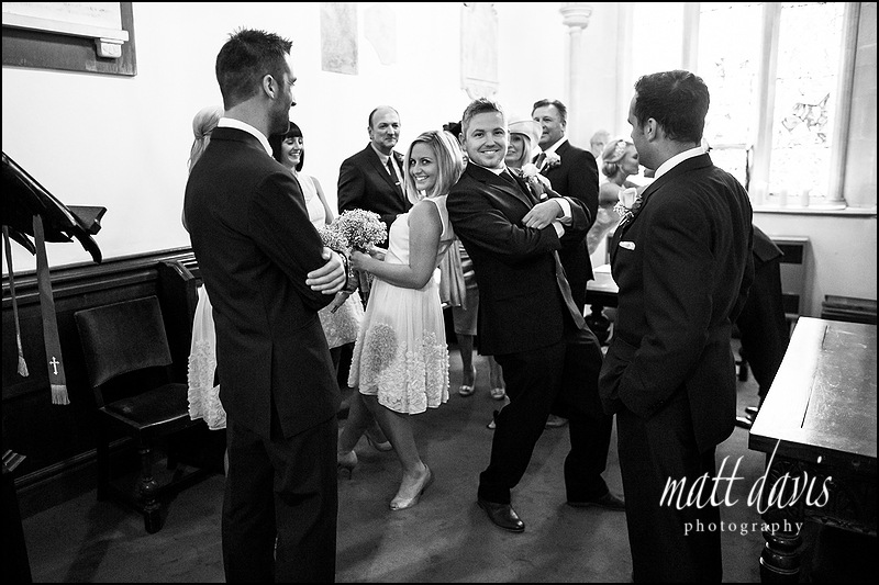 black and white documentary photography of a Wedding at Kingscote Church