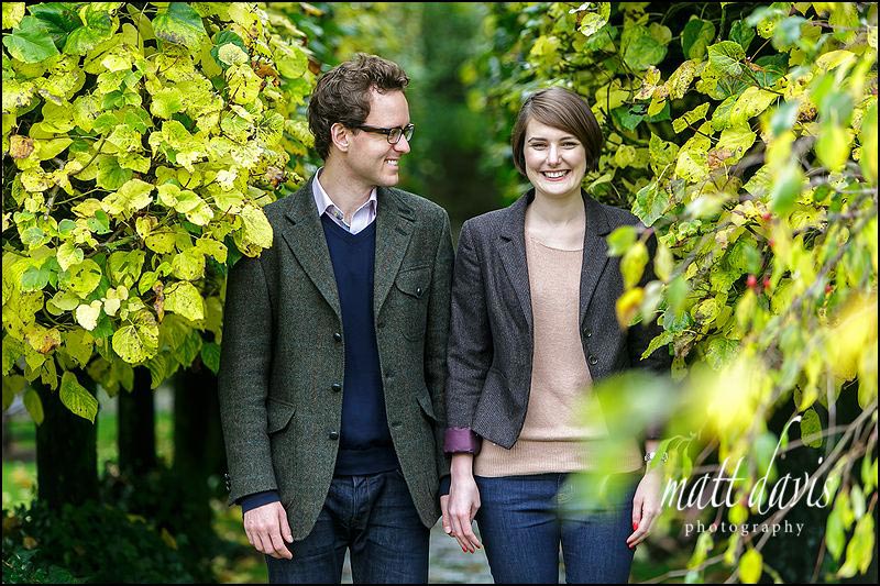 Vibrant autumnal colours make a great Engagement Photo taken in the gardens of Barnsley House Gloucestershire