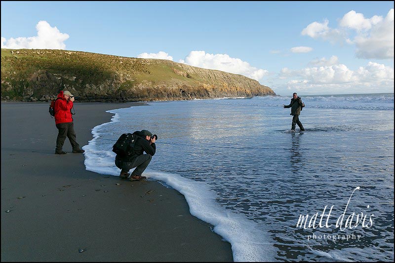 photographers in North Wales get wet whilst shooting surfers