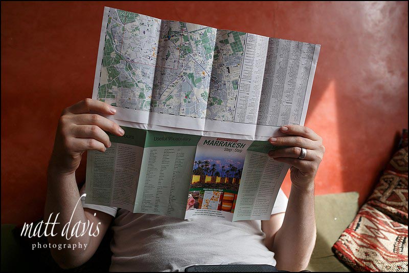 Photographers reading a map of Marrakech