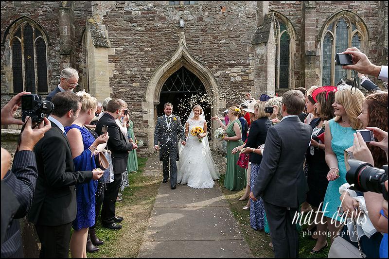 Confetti throwing outside St Mary's church, Berkeley, Gloucestershire
