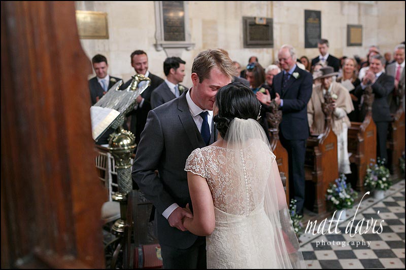 Wedding photos taken inside Sudeley Castle church during the wedding ceremony